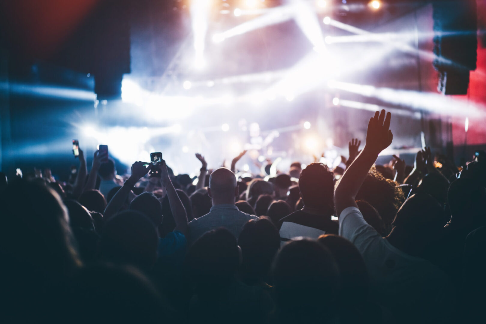Crowd at the concert and blurred stage lights.