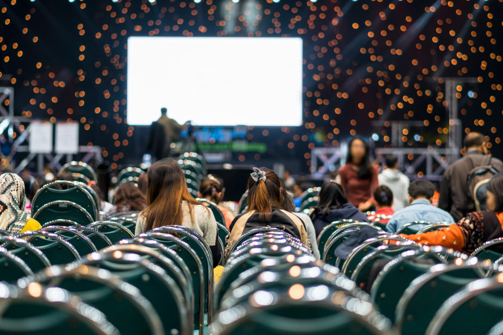 Rear view of audience in the conference hall or seminar meeting